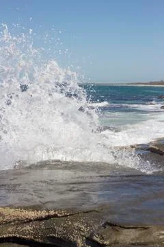 Waves crashing over rocks Stock Photos
