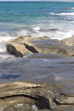 Waves crashing over rocks Stock Photos
