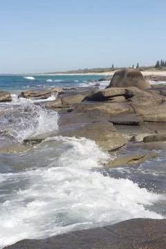 Waves crashing over rocks Stock Photos