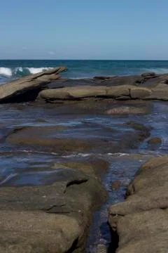 Waves crashing over rocks Stock Photos