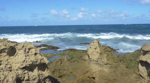 Waves crashing over rocks in Puerto Rico Stock Footage 60748573