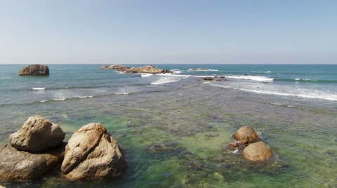Waves crashing over rocks on sea coast Stock-Footage 24952000