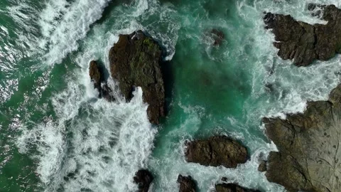 Waves crashing over rocks turquoise Stock Footage 236741355