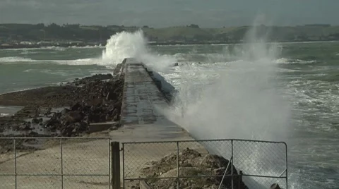 Waves crashing over a water break. Stock Footage 8509723