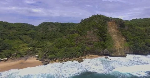 Waves crashing onto a private coast of Java, Indonesia Video stock 71715575