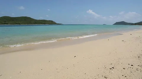 Waves crashing on quiet sandy beach Stock Footage 48786518