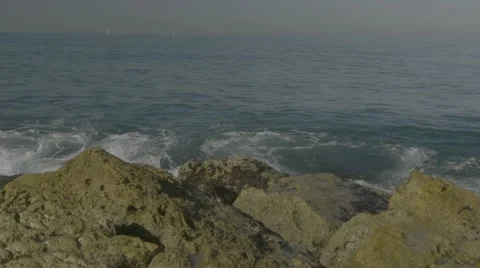 Waves crashing on rock Stock Footage 63632355