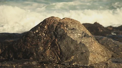 Waves crashing on a rock Stock Footage 73660490