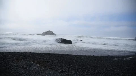 Waves crashing into a rock Stock Footage 161773148