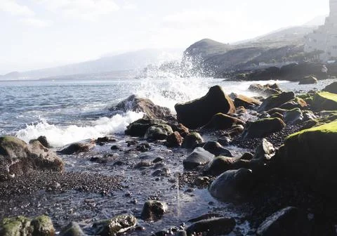 Waves Crashing onto Rock Stock Photos