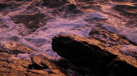 Waves Crashing on Rock at Sunset Stock Footage 8599156