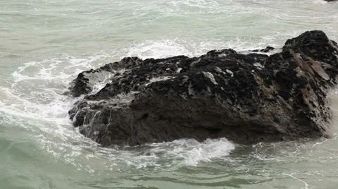 Waves crashing on rocks 1 Stock Footage 33979090