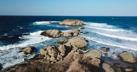Waves crashing into rocks 4k Stock Footage 94431784