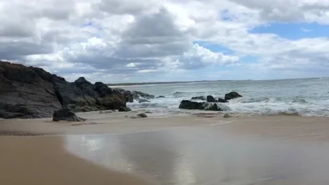 Waves crashing on the rocks at the Beach Stock Footage 138612959