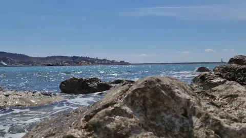 Waves crashing on the rocks on the beach Stock Footage 183822837