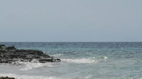 Waves crashing on rocks Stock Footage 21076145