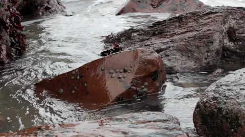 Waves crashing onto rocks Stock Footage 43402803
