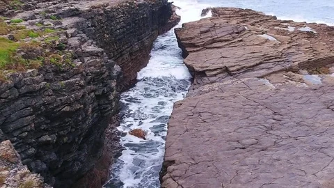Waves crashing into rocks Stock Footage 72269348