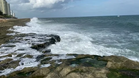 Waves crashing on rocks Stock Footage 147901676