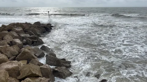 Waves crashing on to rocks Stock Footage 239655724