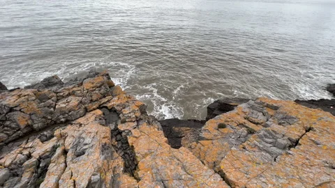 Waves crashing on to rocks Stock Footage 239656409