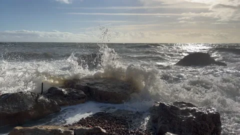 Waves crashing on to rocks Stock Footage 239657718