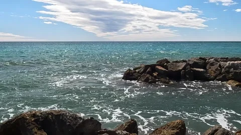 Waves crashing on the rocks in Liguria Stock Footage 317553858