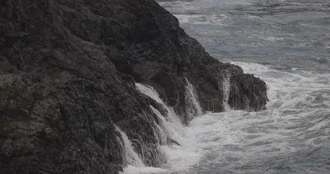 Waves crashing on rocks, Madeira, 4K slomo Stock Footage 246331235