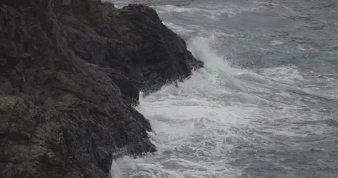 Waves crashing on rocks, Madeira, 4K slomo Stock Footage 246333101