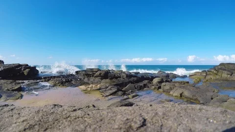 Waves crashing on rocks in Mooloolaba Stock Footage 95821755