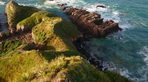 Waves Crashing Onto Rocks, Nugget Point Lighthouse, Pan Up 스톡 동영상 64181791