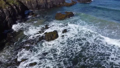 Waves crashing on rocks, ocean waves ocean coast rocks northern ireland 2.7k Video stock 209194081