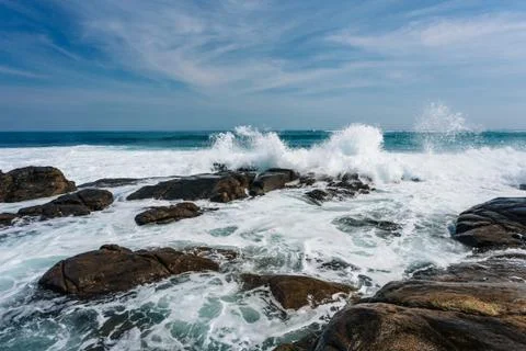 Waves crashing into the rocks Stock Photos