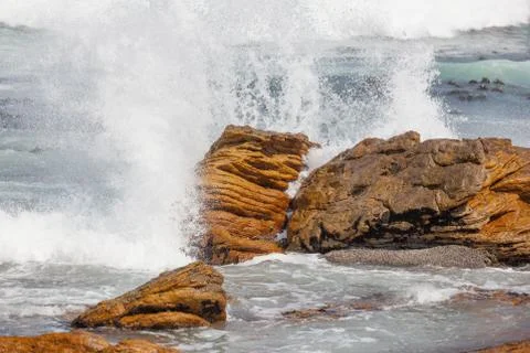 Waves crashing on rocks Stock Photos