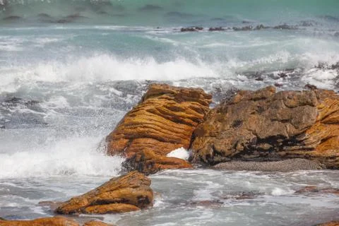Waves crashing on rocks Stock Photos