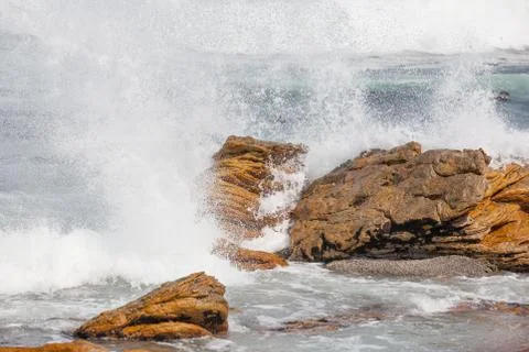 Waves crashing on rocks Stock Photos