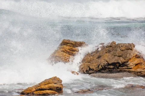 Waves crashing on rocks Stock Photos