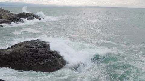 Waves crashing on rocks, rough seas, ocean waves, rugged coastline, Vancouver Stock Footage 238613450