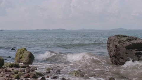 Waves crashing on rocks with sea in background in Singapore Video stock 229828337