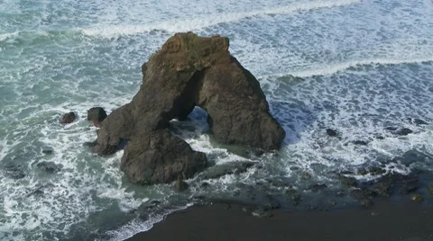 Waves crashing on rocks at shoreline Stock Footage 7729367