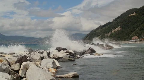 Waves crashing on the rocks slow motion Stock Footage 63711857