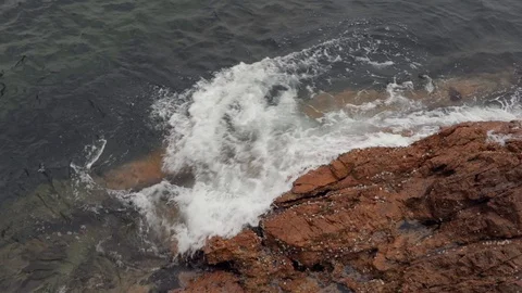 Waves crashing onto rocks, slow motion Stock Footage 97410178