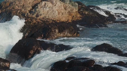 Waves Crashing on Rocks at Sunset – Dramatic Coastal Scene Stock Footage 310534094