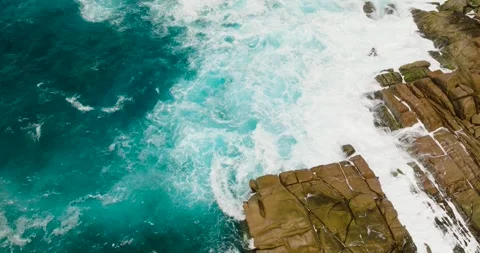 Waves crashing on rocks by turquoise ocean. La Digue, Seychelles. Stock Footage 345384527