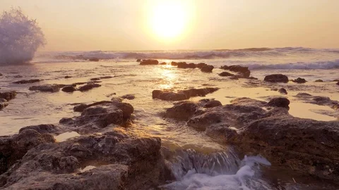 Waves crashing on a rocky beach Stock Footage
