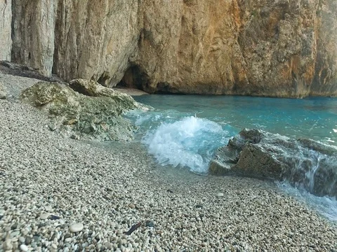 Waves crashing on the rocky shore. Suitable scene for relaxation Stock Footage 80063830