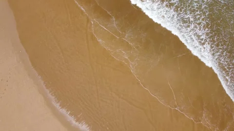 Waves crashing on sand Stock Footage 245760719