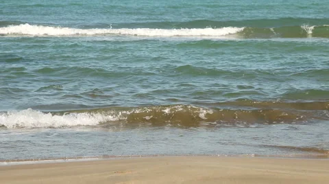 Waves crashing on a sandy beach. Stock Footage 59943339