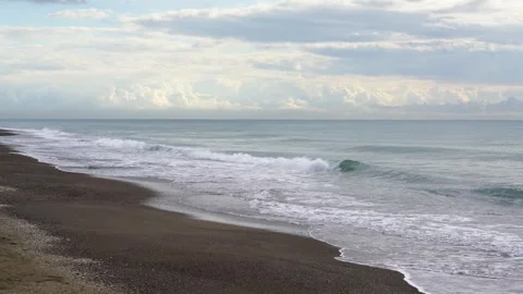 Waves Crashing on Sandy Beach Stock Footage 307909036