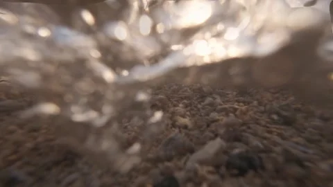 Waves Crashing on Sandy Beach at Sunset. Slowmotion Stock Footage 308989269